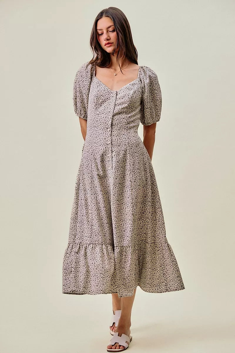 Off-white and black SO ME Ditsy Floral maxi dress by Trendsi featuring a self-belt and elastic waist for a comfortable, stylish fit.