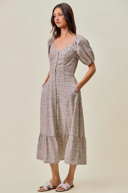 Off-white and black SO ME ditsy floral maxi dress with self-belt and elastic waist, by Trendsi, shown on a model.