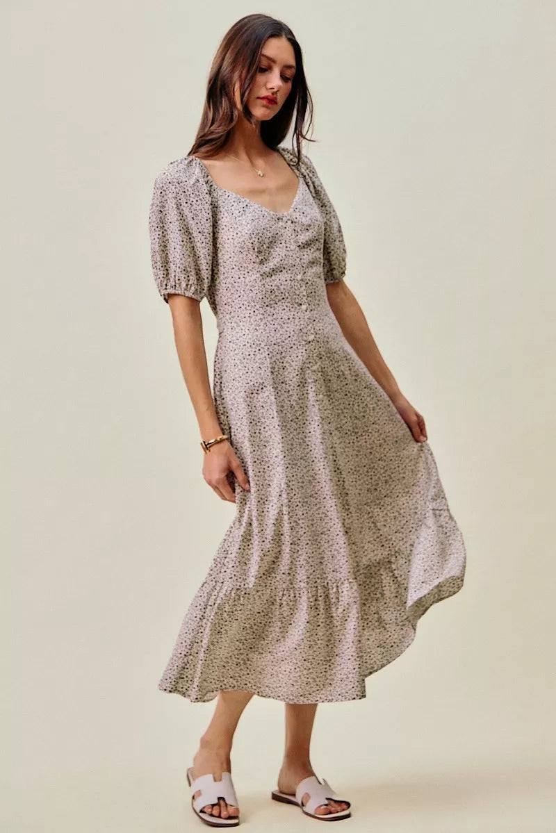 Off-white and black ditsy floral maxi dress with self belt and elastic waist from SO ME by Trendsi, displayed on a hanger.