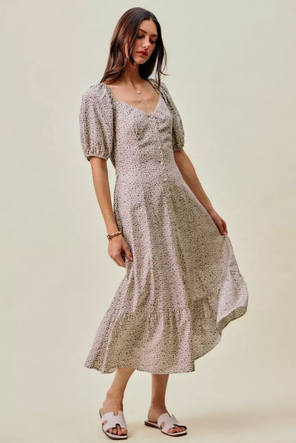 Off-white and black ditsy floral maxi dress with self belt and elastic waist from SO ME by Trendsi, displayed on a hanger.
