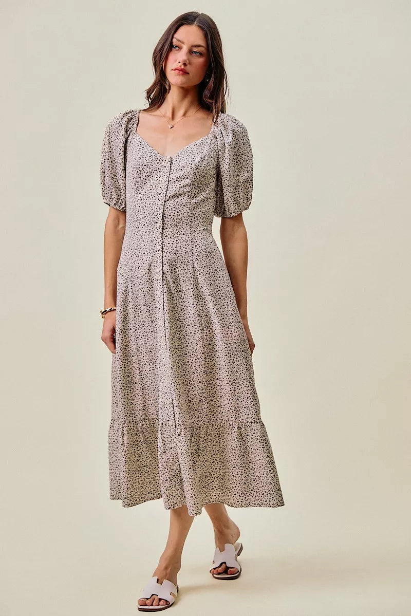 Off-white and black ditsy floral maxi dress by Trendsi with self-belt and elastic waist, featuring a flowy, elegant design.