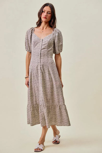 Off-white and black ditsy floral maxi dress by Trendsi with self-belt and elastic waist, featuring a flowy, elegant design.