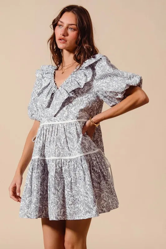 Off-white navy cotton printed ruffle V-neckline dress with side tie, trending fashion by Trendsi.