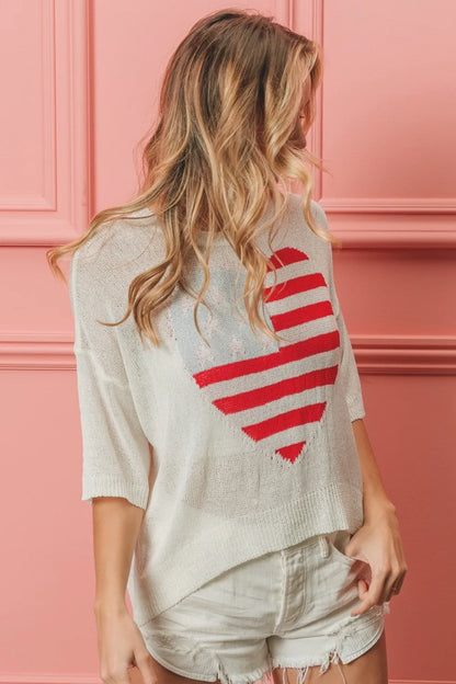 Off-white BiBi striped heart contrast knit top by Trendsi, featuring a cozy knitted fabric with bold heart and stripe patterns.