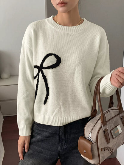 Off-white Bow Graphic Round Neck Sweater by Trendsi featuring a playful bow design on soft knit fabric.