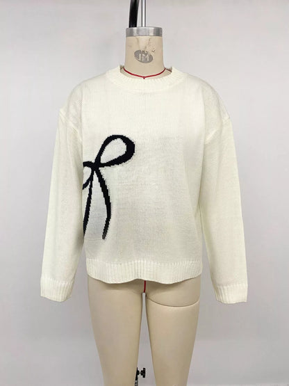 Off-white Bow Graphic Round Neck Sweater by Trendsi, featuring a stylish bow graphic design on a cozy knit fabric.
