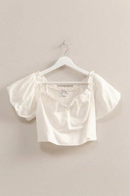 Off-white HYFVE puff sleeve sweetheart neck top with fitted bodice and ruffled sleeves, shown on a model.