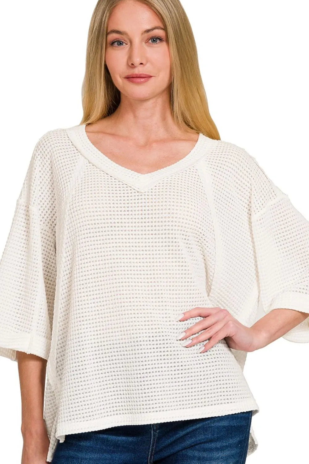 Off-white Zenana brushed waffle 3/4 sleeve top with exposed seams, featuring a relaxed fit and casual style.