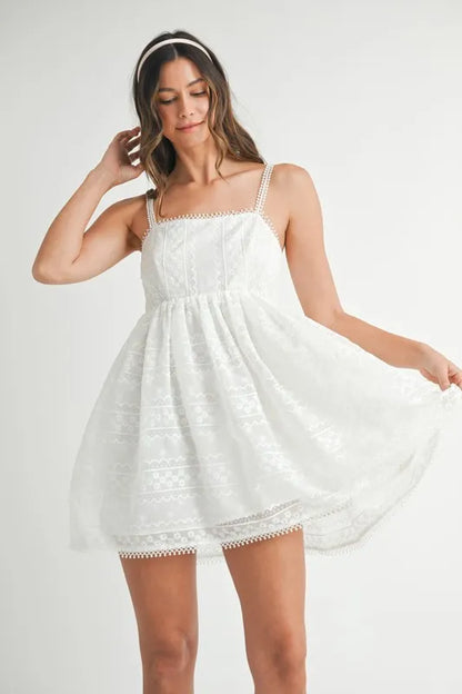 Off-white MABLE eyelet lace babydoll mini cami dress with delicate eyelet details and adjustable straps, perfect for casual wear.