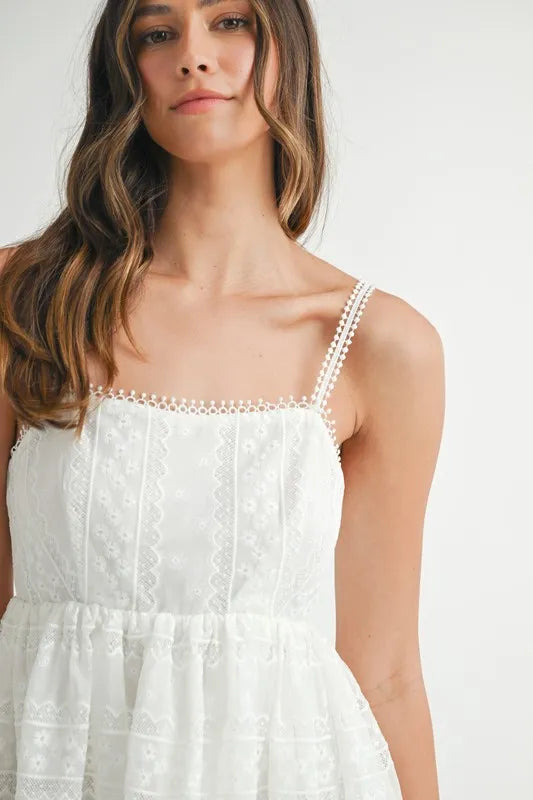 Off-white MABLE eyelet lace babydoll mini cami dress with spaghetti straps and delicate lace details, perfect for casual or dressy occasions.