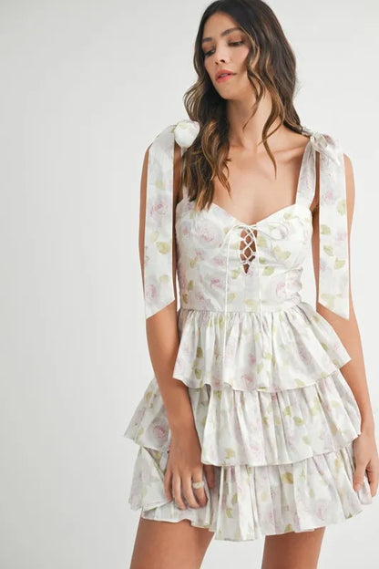 Off-white MABLE floral print layered mini dress with shoulder ties, featuring a stylish, feminine design.