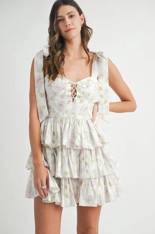 Off-white MABLE floral print shoulder tie layered mini dress by Trendsi, featuring a stylish floral pattern and layered design.