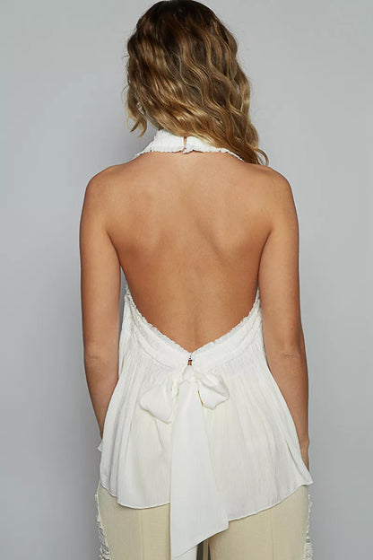 Off-white POL backless halter sleeveless top by Trendsi with smocking and shirring detail, shown on a model.