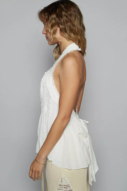 Off-white POL backless halter sleeveless top with smocking and shirring detail, stylish and lightweight for warm weather.