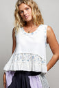 Off-white floral print ribbed tank top with round neck and double gauze ruffle accents from Trendsi.