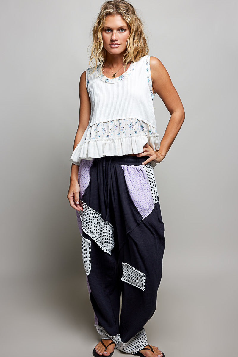 Off-white floral print POL patch round neck ribbed tank top with double gauze ruffle accents, by Trendsi.