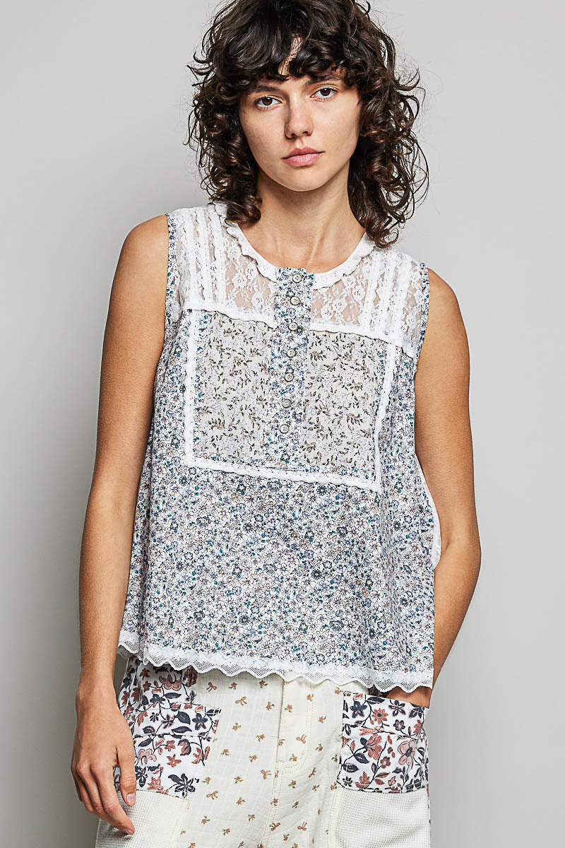 Off-white sleeveless woven top with printed design and lace back, featuring a round neck by Trendsi.