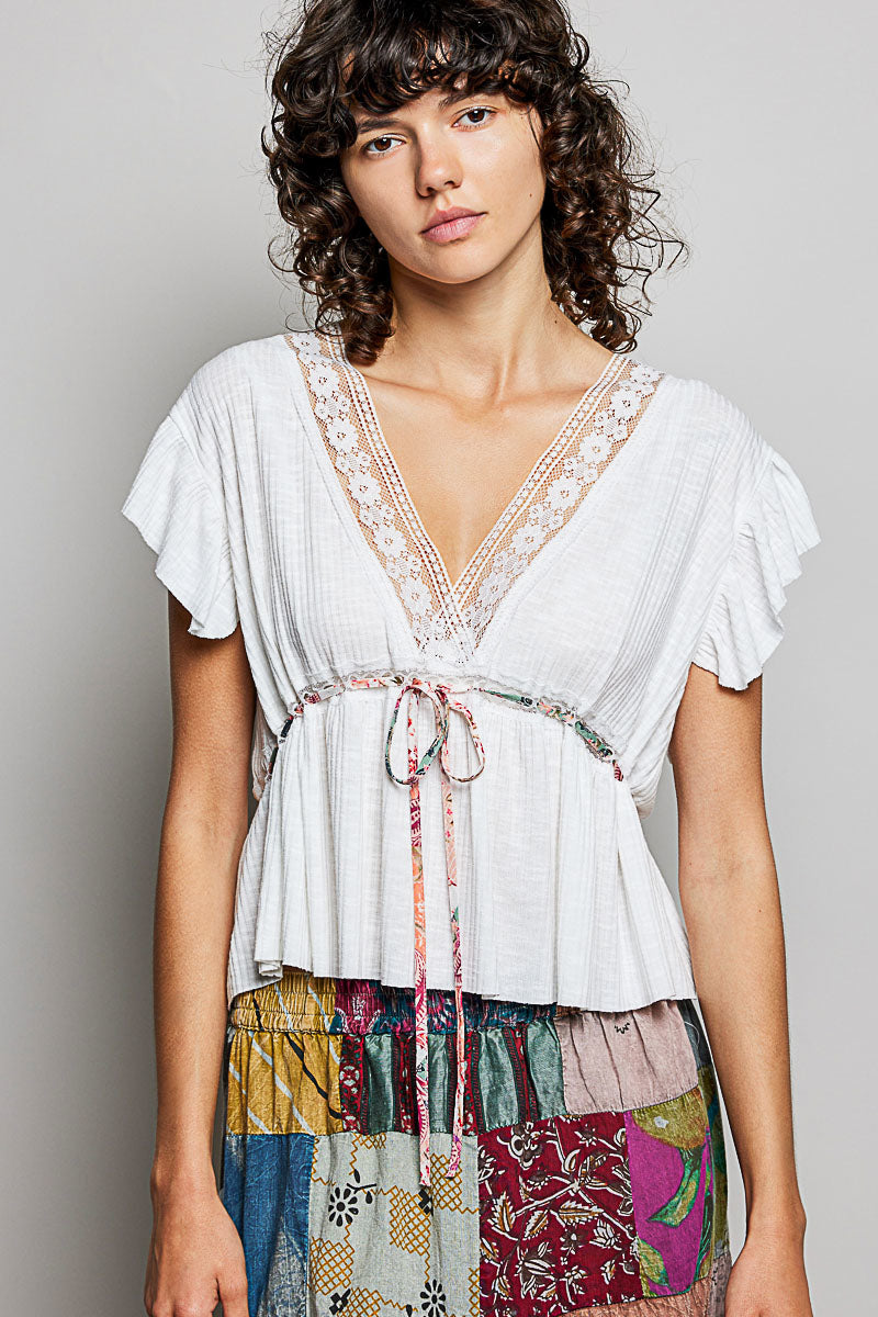 Off-white POL Tied Ruffled V-Neck Short Sleeve Blouse with Lace Detail from Trendsi, featuring delicate ruffles and lace accents.