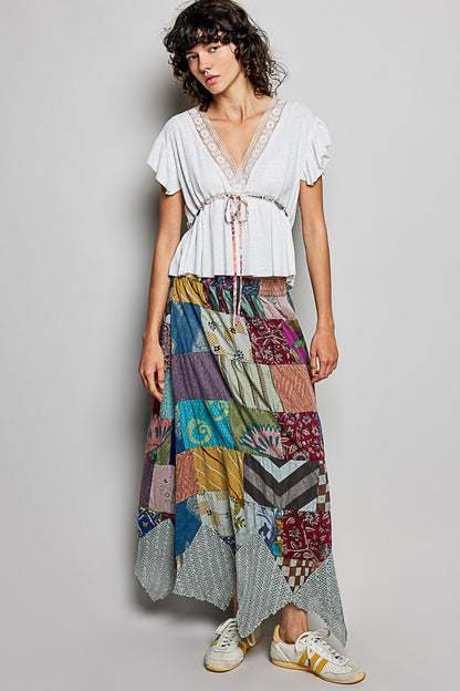 Off-white Trendsi POL tied ruffled V-neck short sleeve blouse with lace details, showcasing its elegant design and feminine style.
