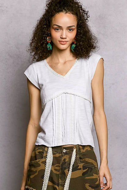 Off-white Trendsi V-neck lightweight textured knit top with short sleeves and delicate lace trim, designed for a stylish casual look.