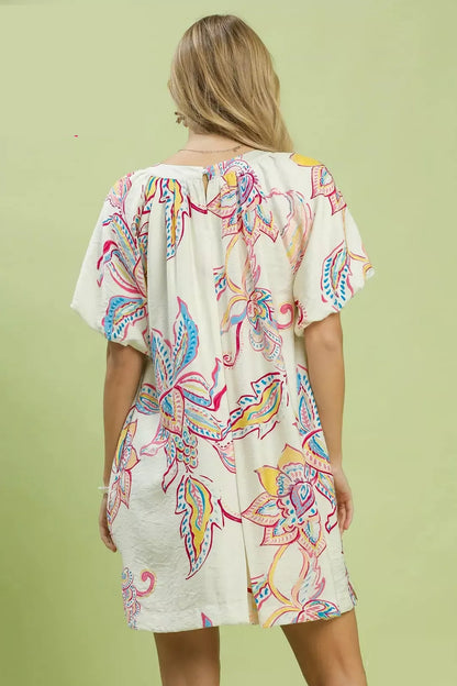Off-white Umgee boho floral print mini dress with pockets, casual summer dress with relaxed fit and stylish design.