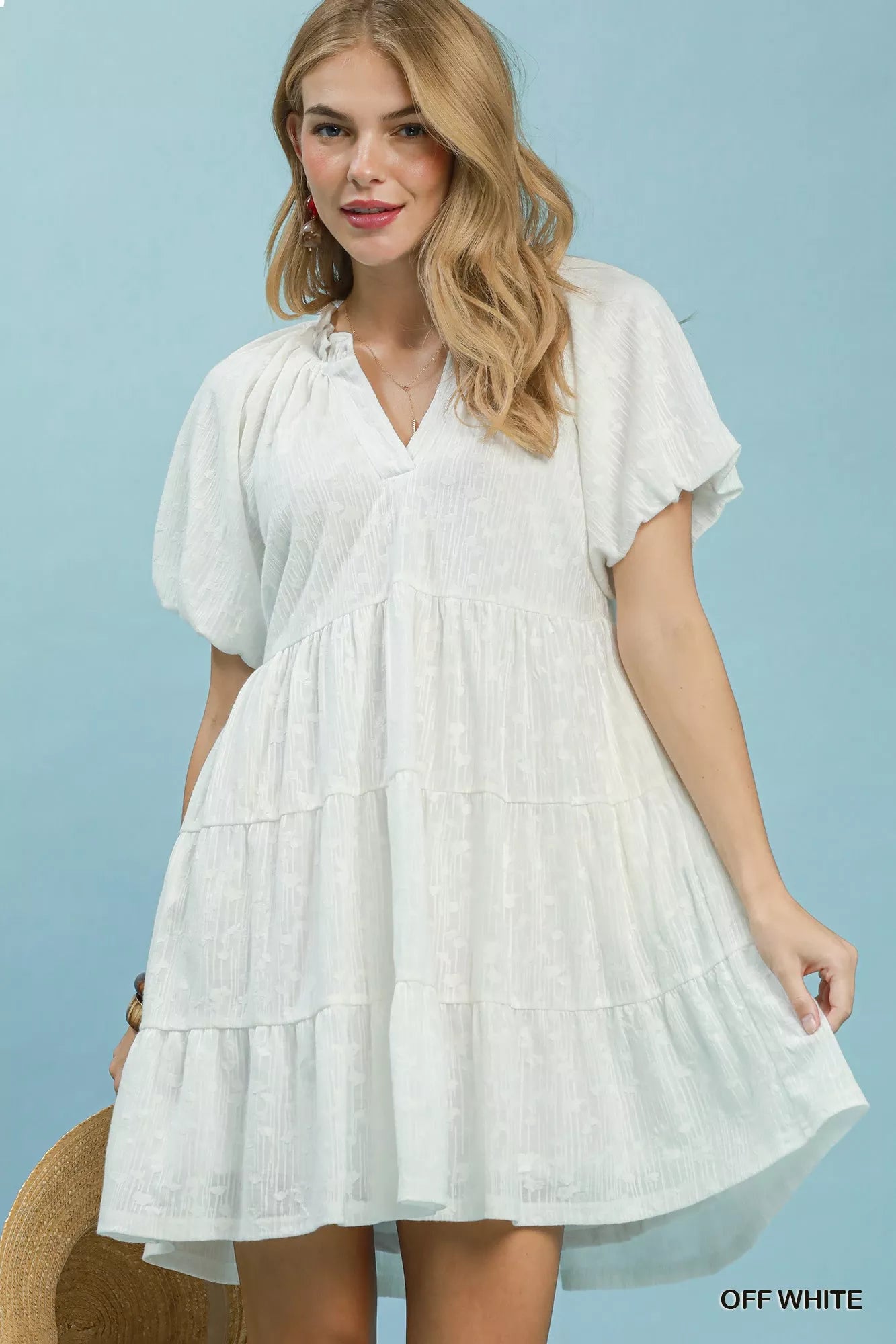 Off-white Umgee Jacquard Puff Sleeve Mini Dress with intricate pattern and stylish puff sleeves, perfect for casual or semi-formal wear.