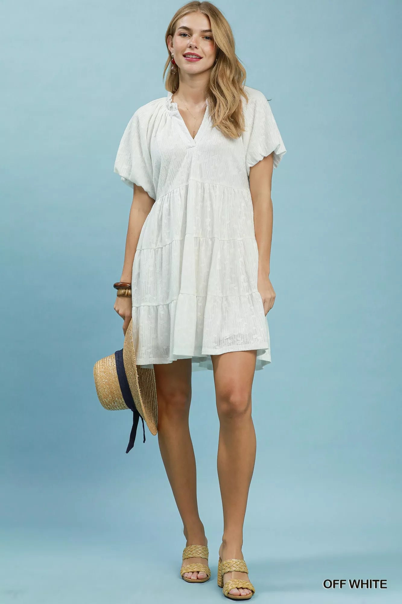 Off-white Umgee Jacquard Puff Sleeve Mini Dress with a fitted silhouette and intricate fabric pattern.
