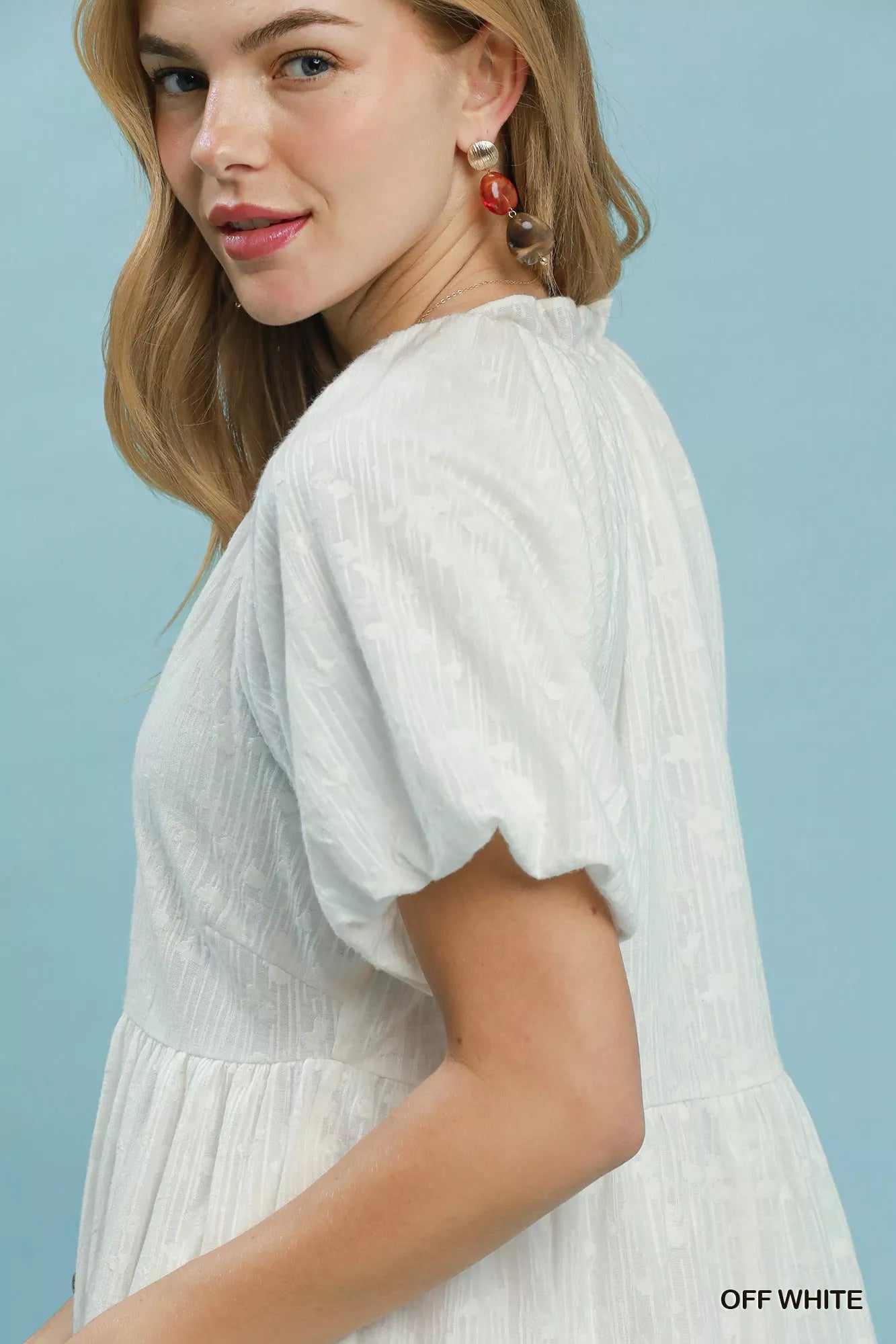 Off-white Umgee Jacquard Puff Sleeve Mini Dress with textured fabric and fitted silhouette, stylish for casual or dressy occasions.