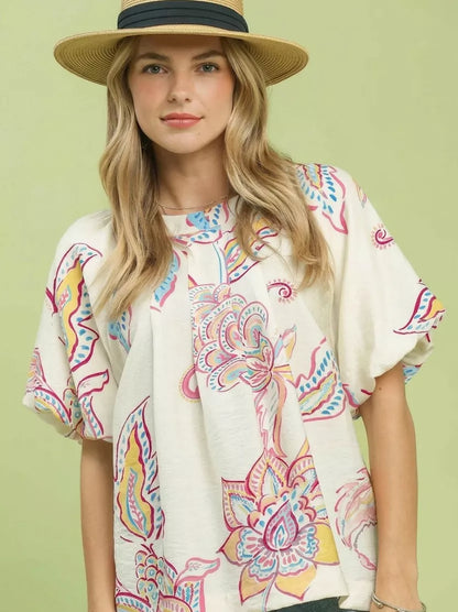 Off-white Umgee paisley print puff sleeve top with ruffled details, showcasing a stylish boho-inspired design.