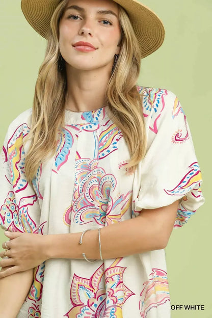 Off-white Umgee paisley print puff sleeve top with ruffled detailing and a relaxed fit, perfect for casual or boho outfits.