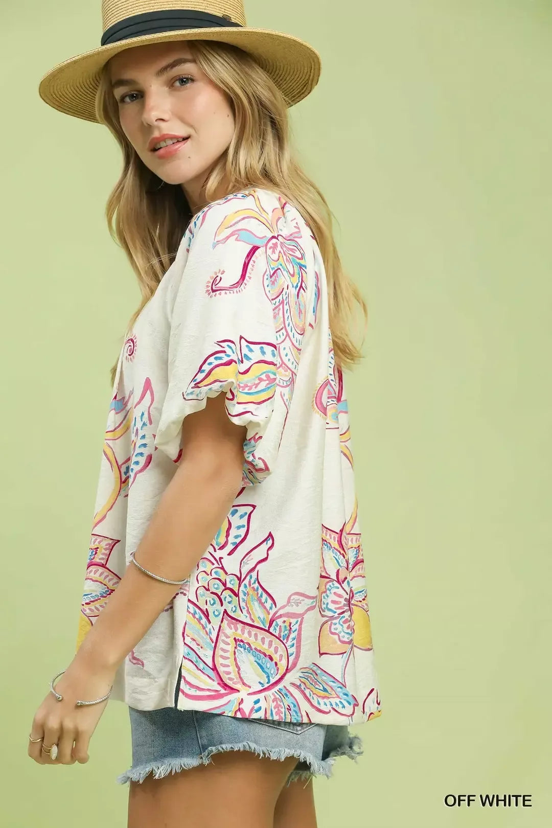 Off-white Umgee paisley print puff sleeve top with ruffled cuffs, stylish and lightweight, perfect for casual or dressy occasions.