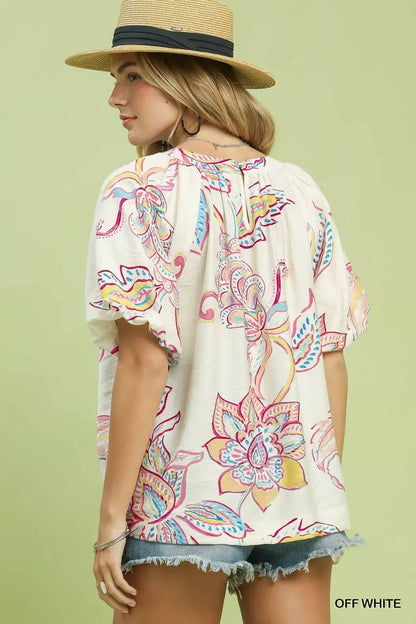 Off-white Umgee paisley print puff sleeve top with ruffled details, featuring a stylish and feminine design.
