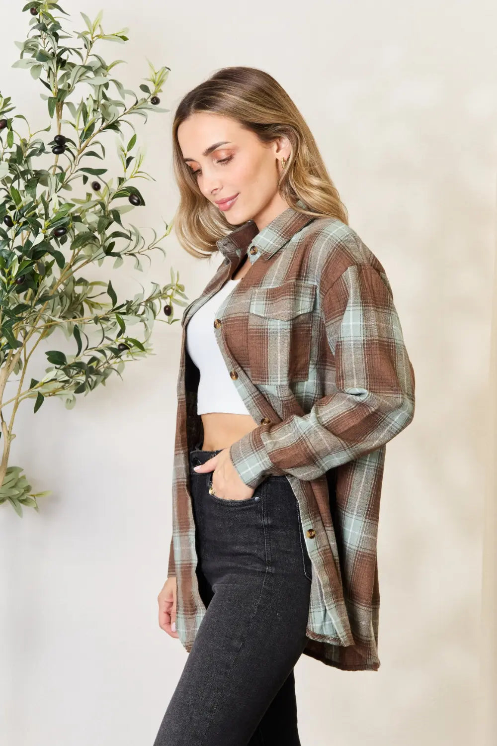 Olive brown Mandy plaid dropped shoulder shirt by Trendsi, featuring a relaxed fit and casual style, shown on a model.