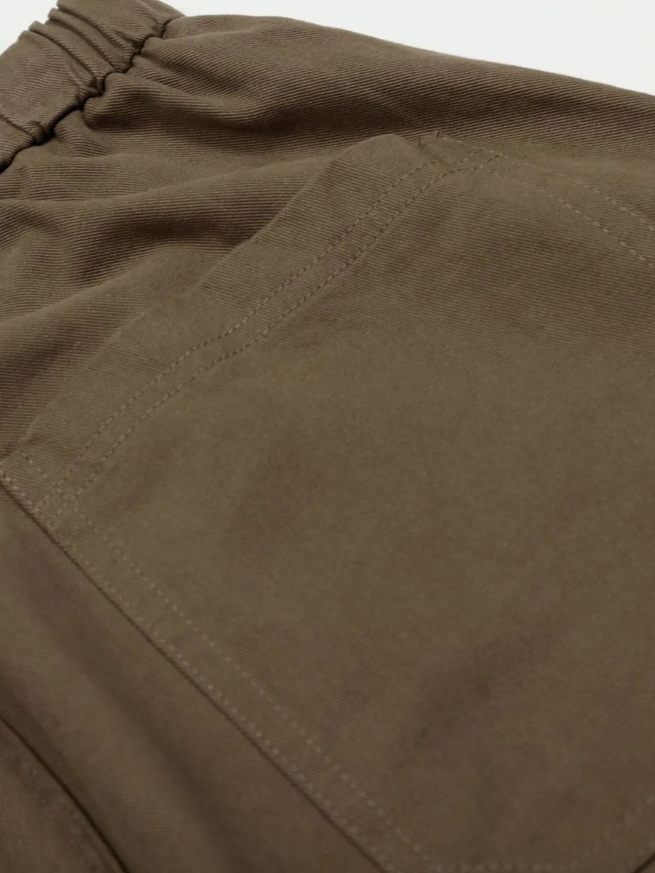 Men's olive brown wide-leg drawstring elastic waist pants by Trendsi, showing relaxed fit and comfortable elastic waistband.