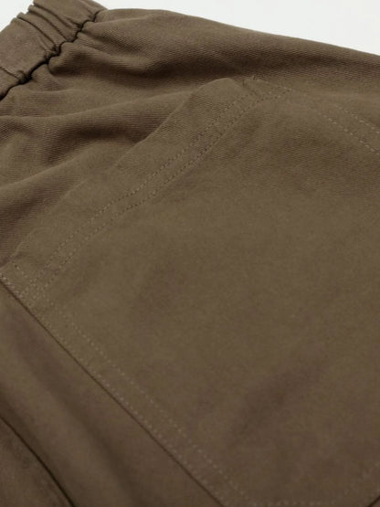 Men's olive brown wide-leg drawstring elastic waist pants by Trendsi, showing relaxed fit and comfortable elastic waistband.