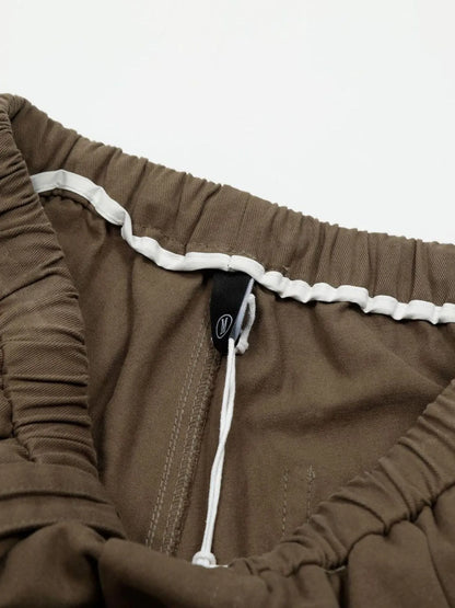 Men's olive brown wide-leg drawstring elastic waist pants by Trendsi, featuring comfortable relaxed fit and casual style.