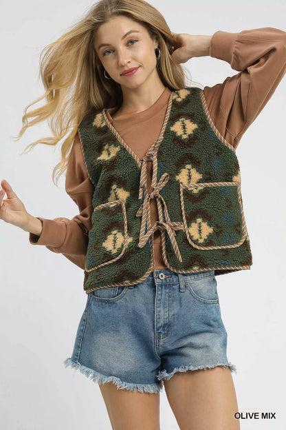 Olive green Umgee mix patterned sherpa tie-front vest with cozy textured fabric and stylish front tie detail.