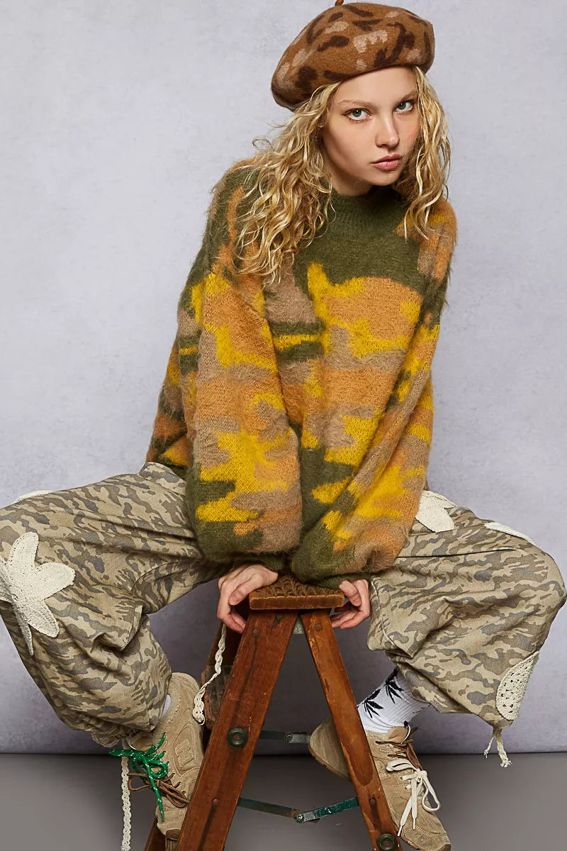 Olive and multi-color abstract pattern mock neck sweater by Trendsi, featuring colorblock design and cozy knit fabric.