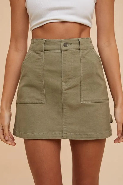 Olive green Annie Wear cargo denim mini skirt with side pockets, styled for casual wear, by Trendsi.