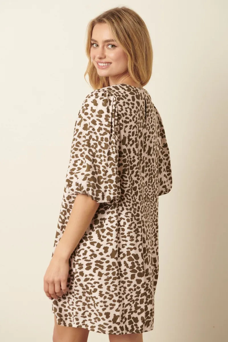 Olive green animal print puff sleeve mini dress by Mittoshop, featuring a fitted silhouette and stylish design.