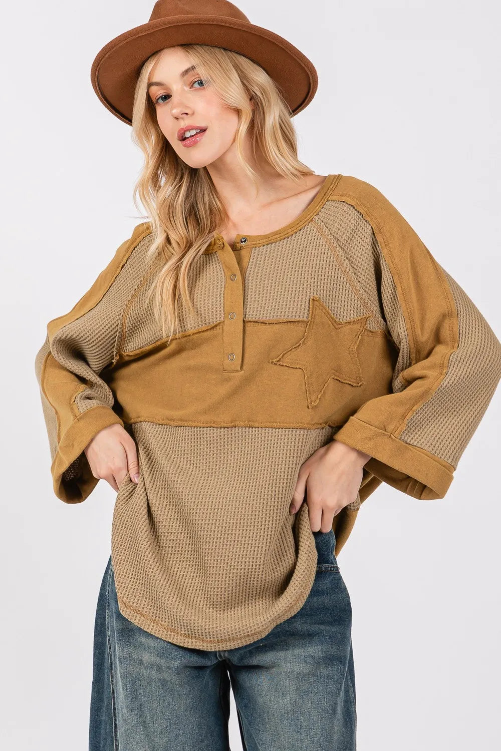 Olive green waffle knit top with sage and fig star applique patch and exposed seam detailing, trendy and casual for everyday wear.