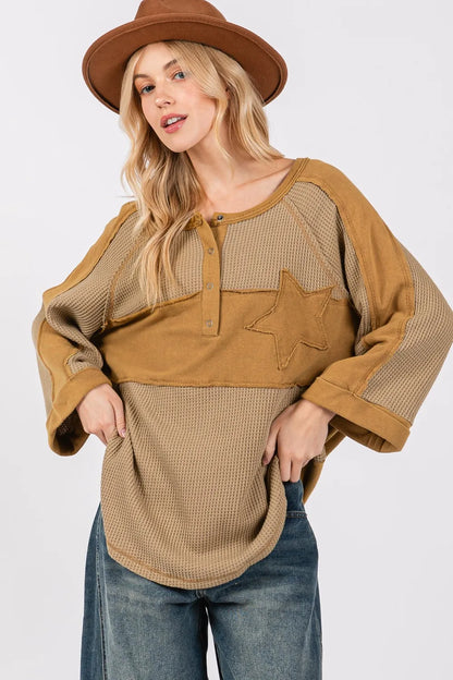 Olive green waffle knit top with sage and fig star applique patch and exposed seam detailing, trendy and casual for everyday wear.