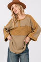 Olive green waffle knit top with sage and fig star applique patch and exposed seam detailing, trendy and casual for everyday wear.