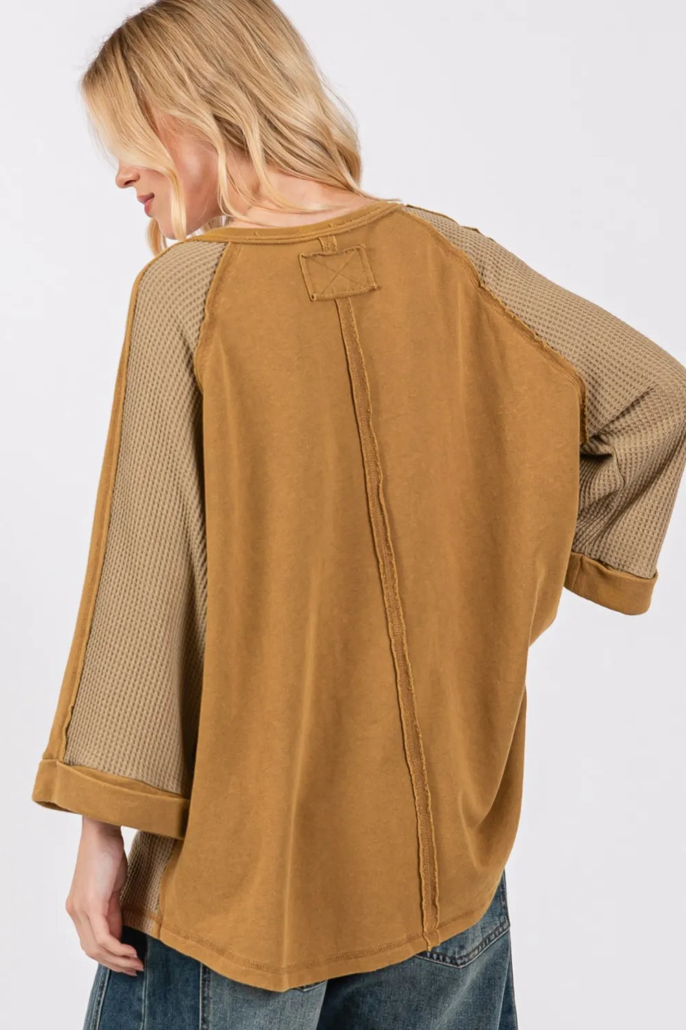 Olive green waffle knit top with sage and fig star applique patch and exposed seam details, casual and stylish Trendsi women’s top.