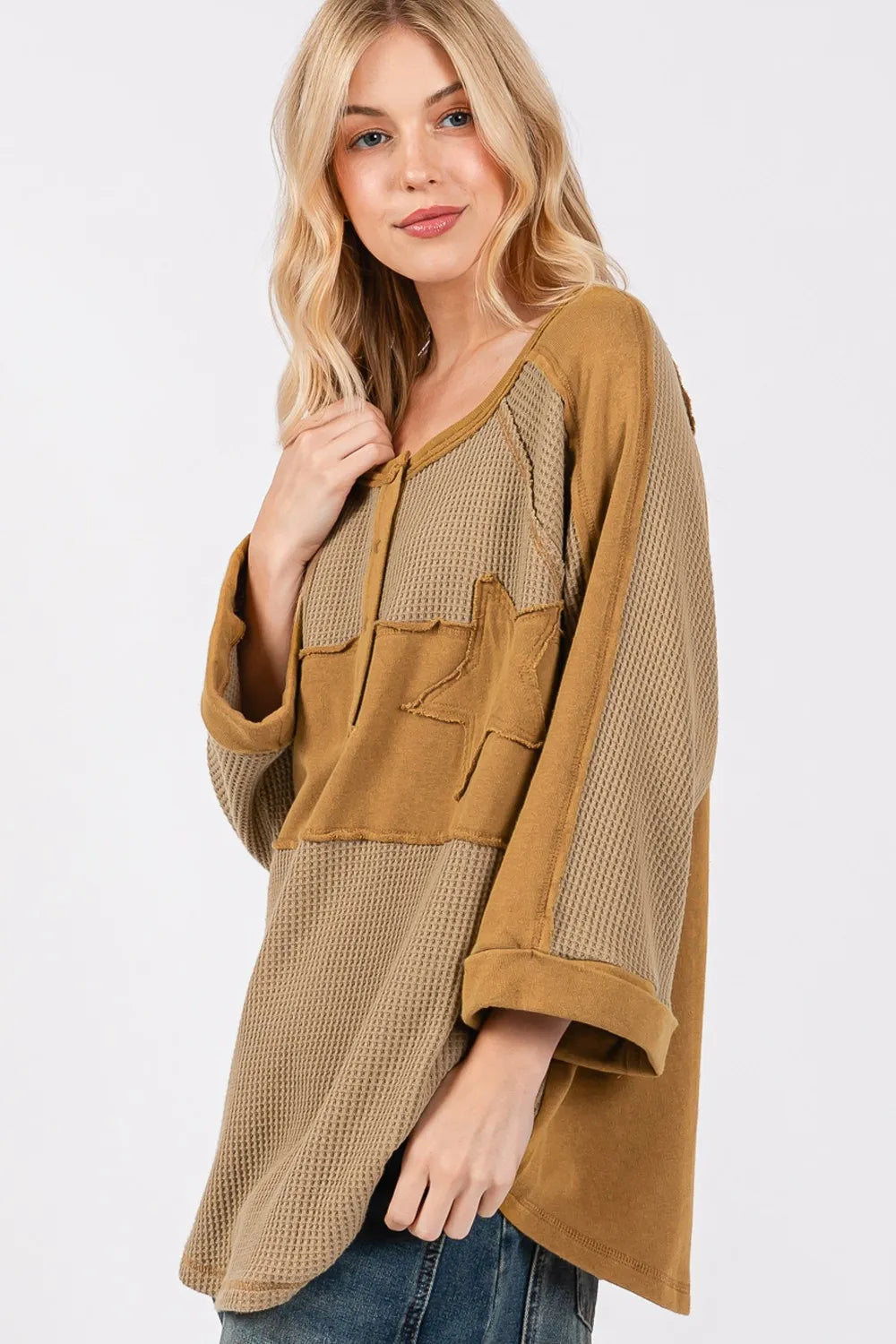 Olive green waffle knit top with sage and fig star applique patch and exposed seams, casual trendy women's knit top by Trendsi.