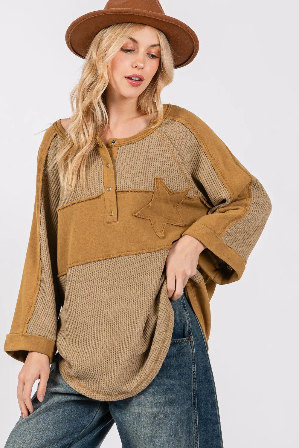 Olive green waffle knit top with sage and fig star applique patches and exposed seam details, casual trendy women's fashion by Trendsi.