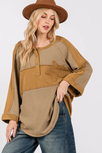 Olive green waffle knit top with sage and fig star applique patches and exposed seam details, casual trendy women's fashion by Trendsi.