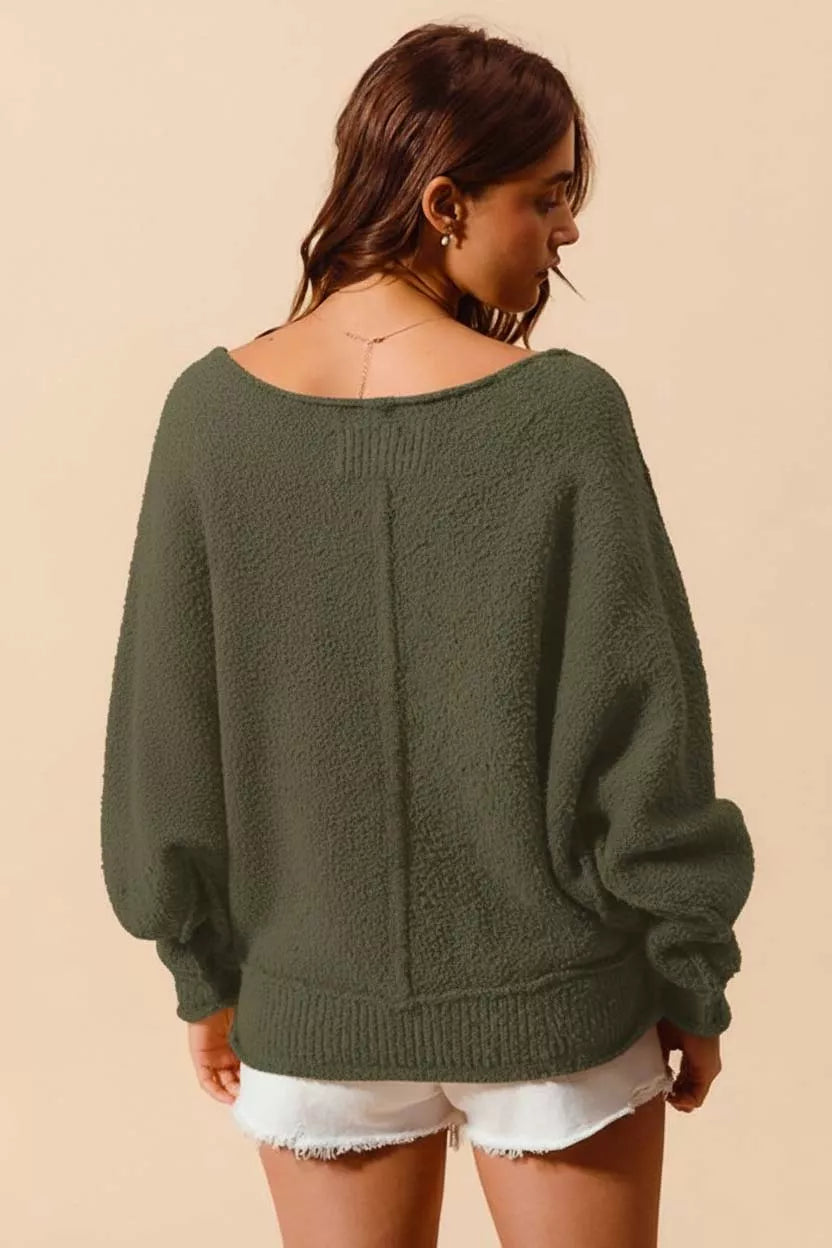 Olive green SO ME loose fit boucle sweater with exposed seams and slouchy style, featuring a textured boucle knit fabric.