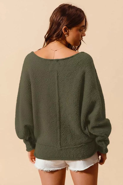 Olive green SO ME loose fit boucle sweater with exposed seams and slouchy style, featuring a textured boucle knit fabric.