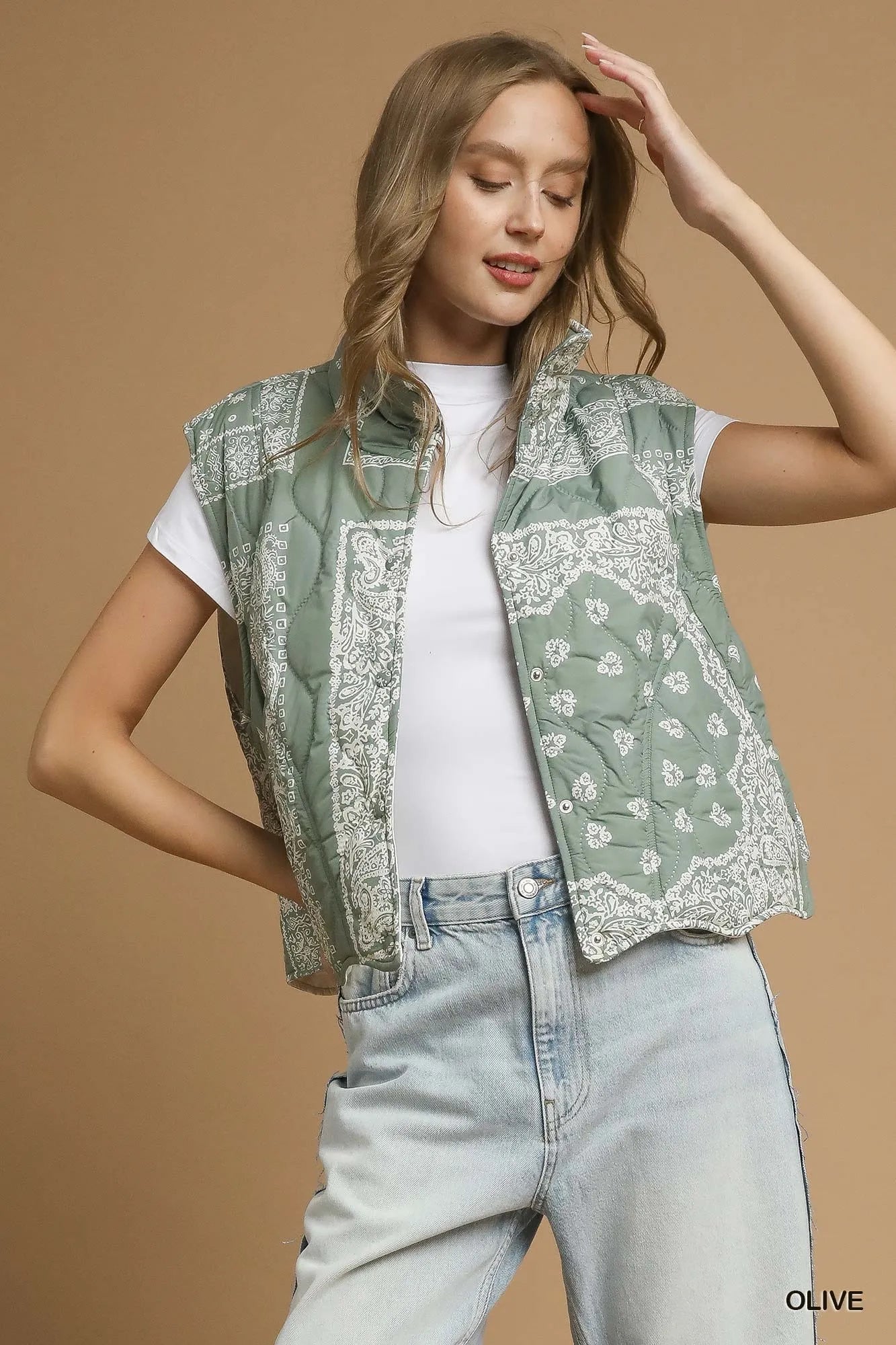 Olive green Umgee bandana print quilted puffer vest with stand collar and front zipper, stylish and warm outerwear.